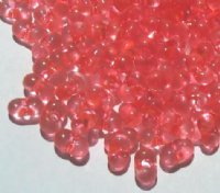 25 grams of 3x7mm Transparent Coral Farfalle Seed Beads